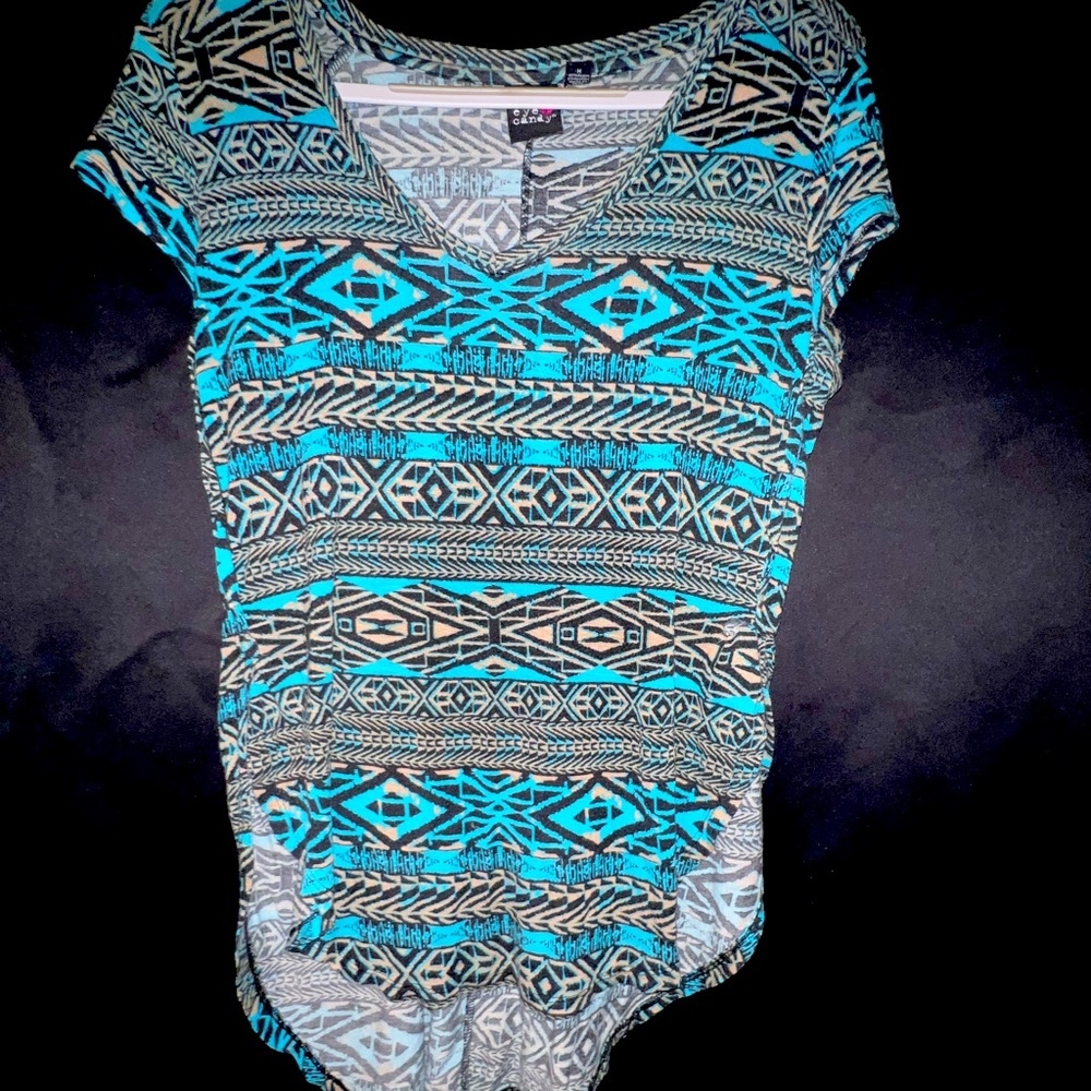 Eye Candy medium shirt with a half sleeve and tail in the back.